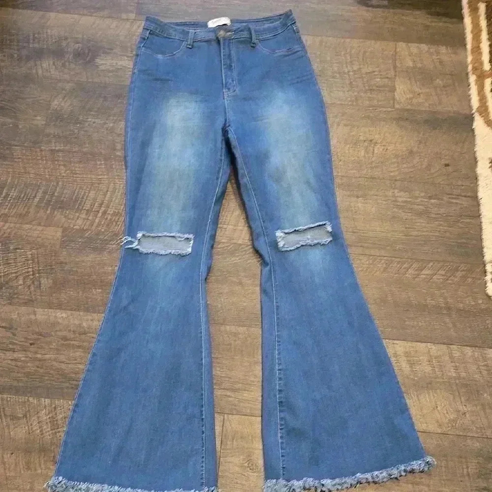 Blue Distressed Flare Jeans with Raw Hem